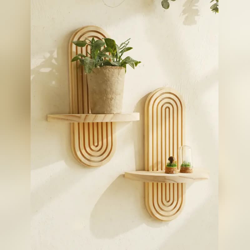 Two fluted natural-wood arch wall shelves on a cream wall, styled with a potted plant and tiny terrariums (seller photo from the AliExpress listing)